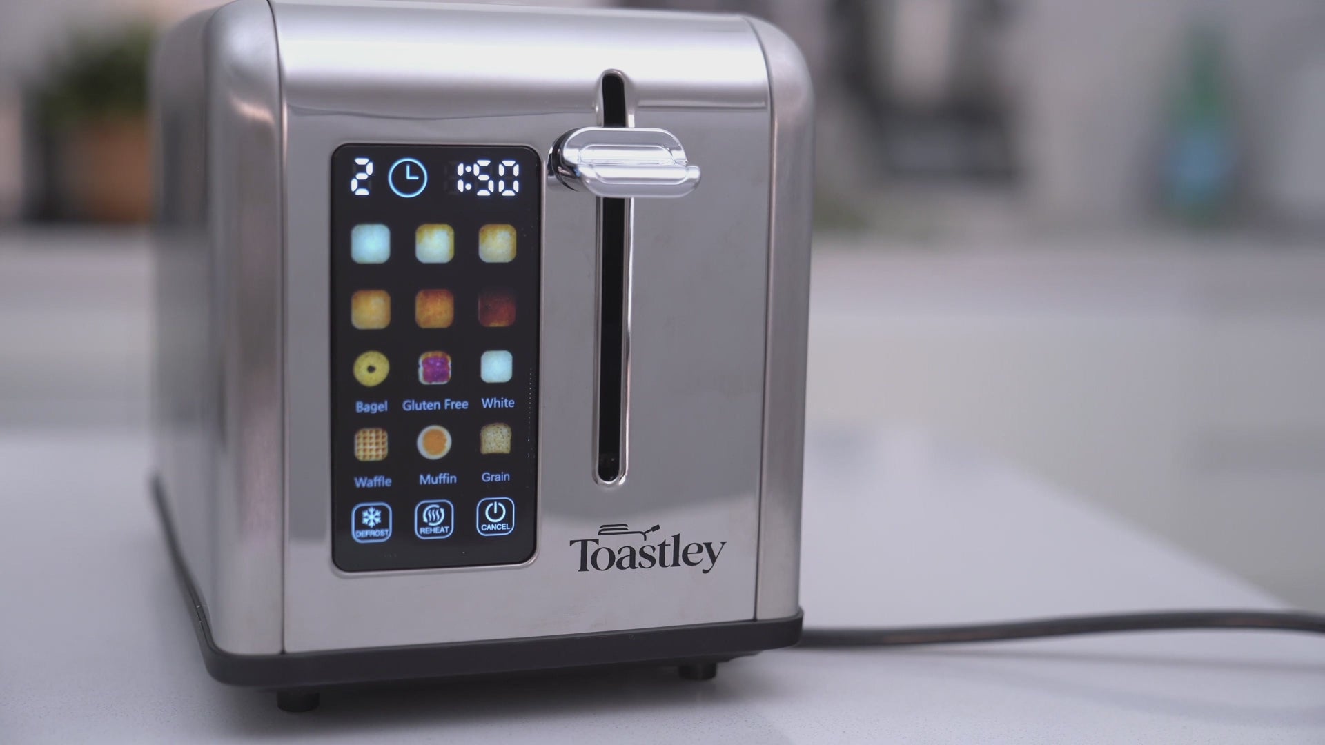 Video of the Toastley 2 slice smart toaster being used, showing the touchscreen and toast popping up